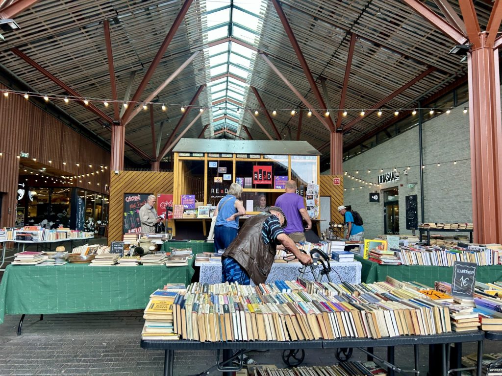 A secondhand book store in the middle of market.