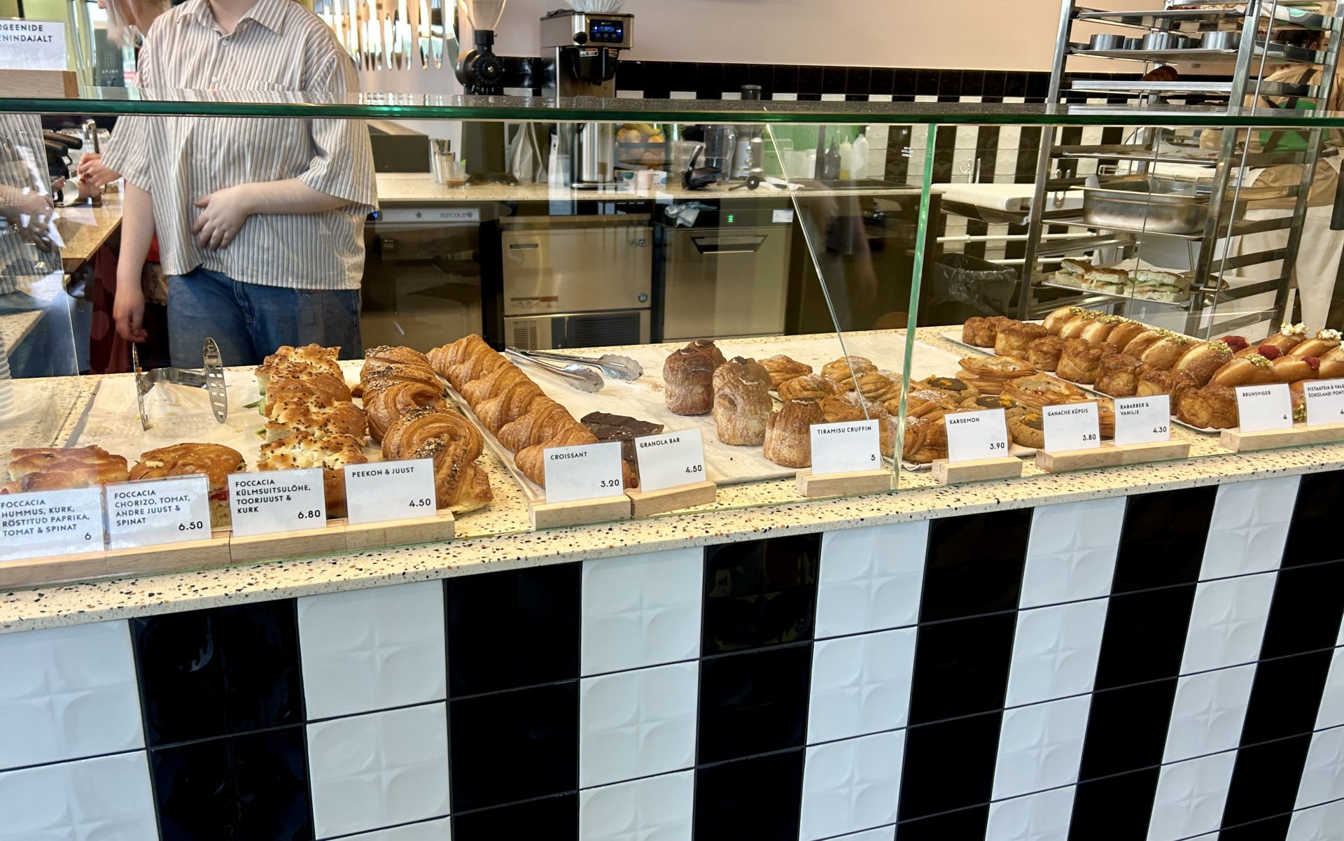 Patisseries in the window display of a coffee shop.