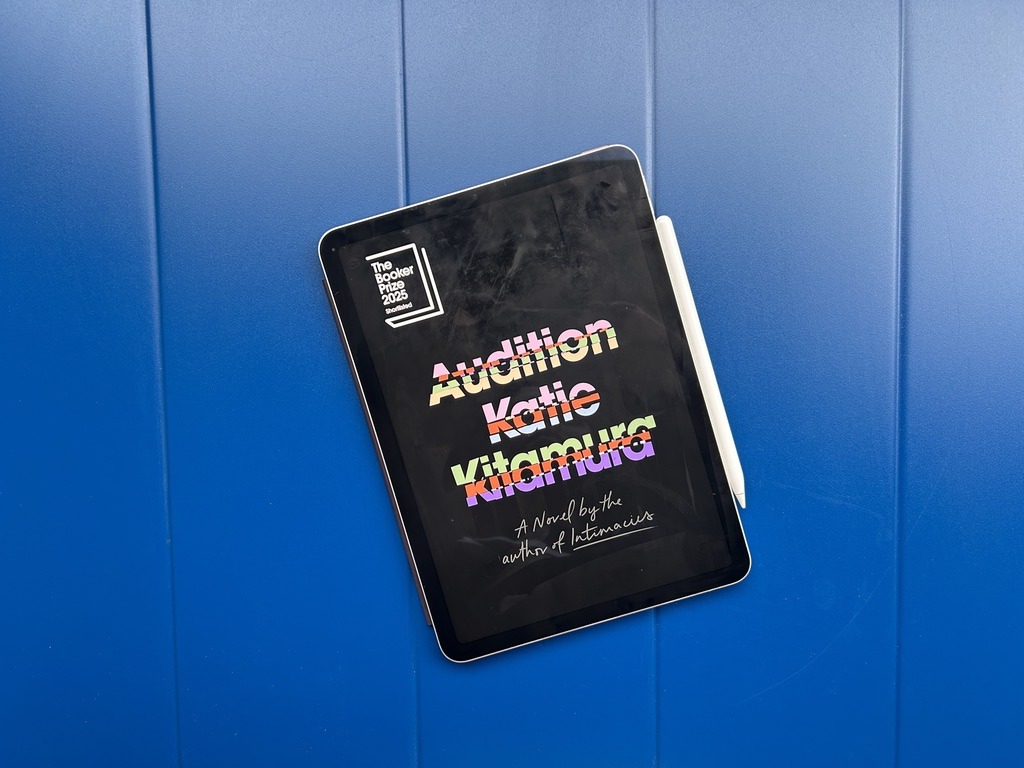 Audition eBook on a blue table