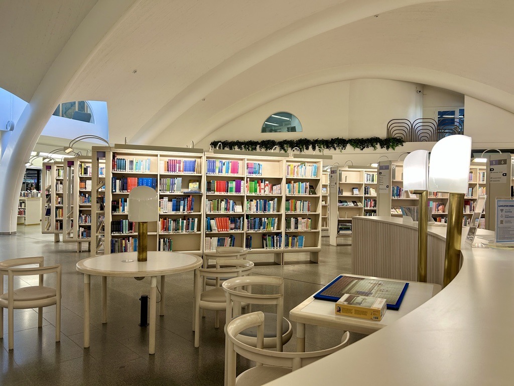 White tables and chairs inside a library