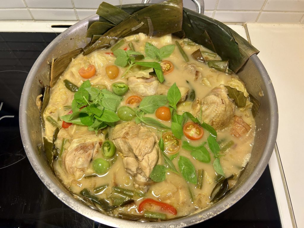 A pan of garang asem, a spicy and sour Indonesian dish, made with fresh tomatoes